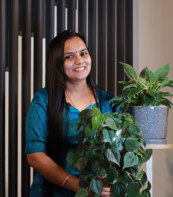 Woman caring for plants in the nursery