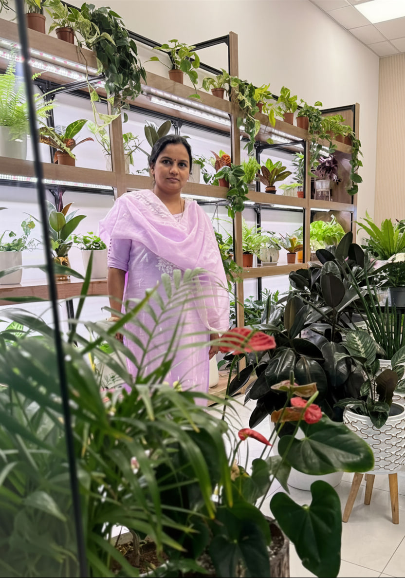 Woman caring for plants in the nursery